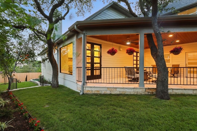 6905 Rudi Cv, Austin, TX 78759 - back of property featuring a patio, a chimney, and a ceiling fan