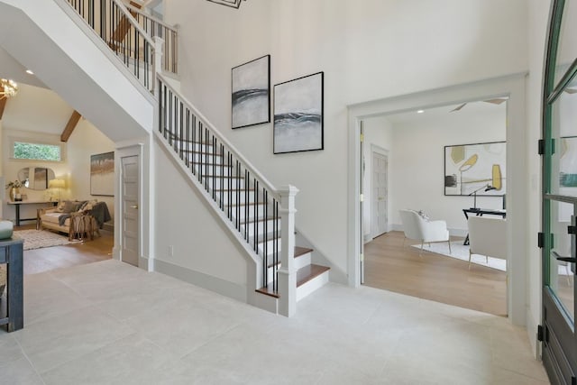 6905 Rudi Cv, Austin, TX 78759 - stairs featuring a high ceiling and tile patterned flooring