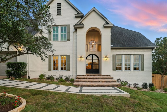 6905 Rudi Cv, Austin, TX 78759 - view of front of home with brick siding and a shingled roof