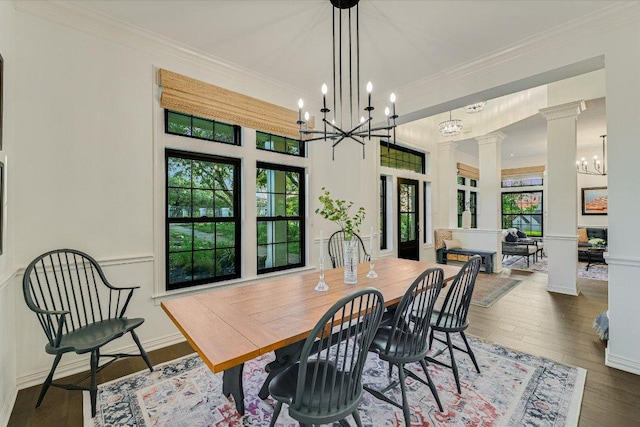 3342 Far View Dr, Austin, TX 78730 - dining room with healthy amount of natural light, decorative columns, a chandelier, ornamental molding, and wood finished floors