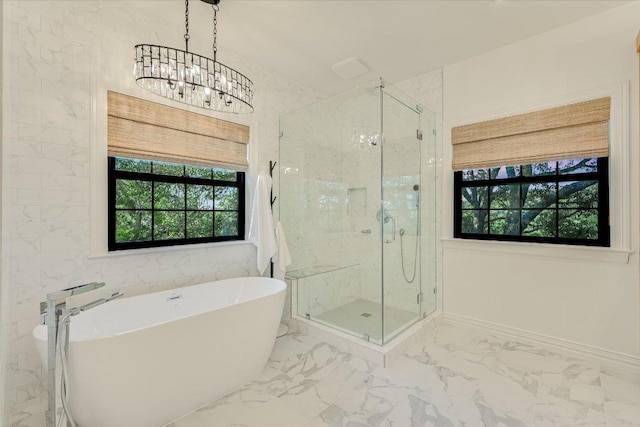 3342 Far View Dr, Austin, TX 78730 - full bath with marble finish floors, a soaking tub, a chandelier, and a stall shower