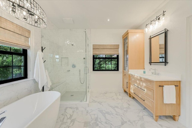 3342 Far View Dr, Austin, TX 78730 - full bath featuring marble look tiles, a freestanding tub, a shower stall, and plenty of natural light