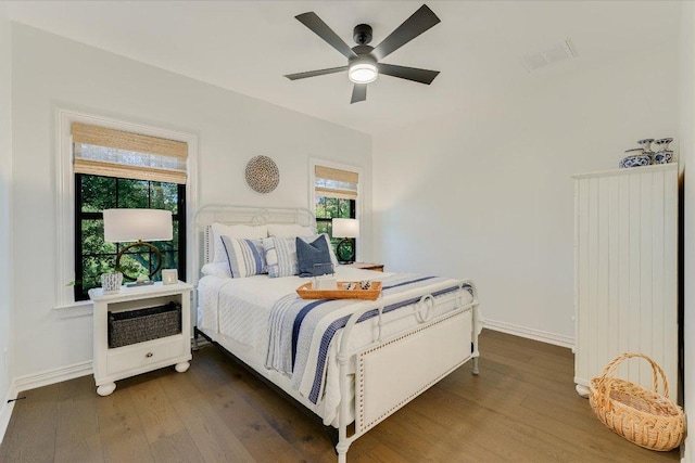 3342 Far View Dr, Austin, TX 78730 - bedroom with wood finished floors, heating unit, and ceiling fan