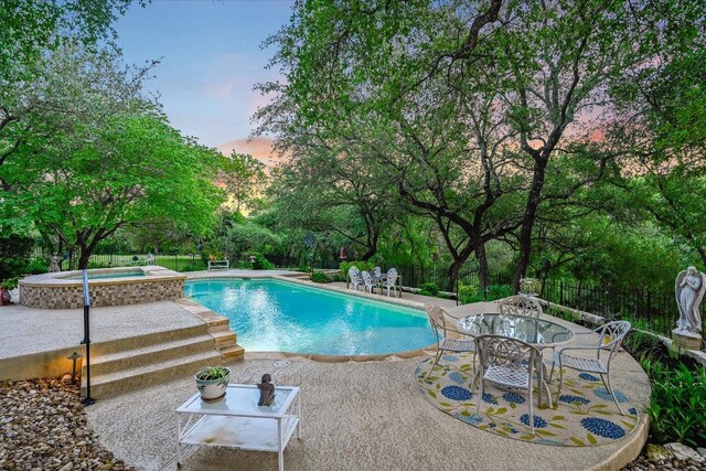 9105 Westminster Glen Ave, Austin, TX 78730 - outdoor pool with an in-ground hot tub and a patio
