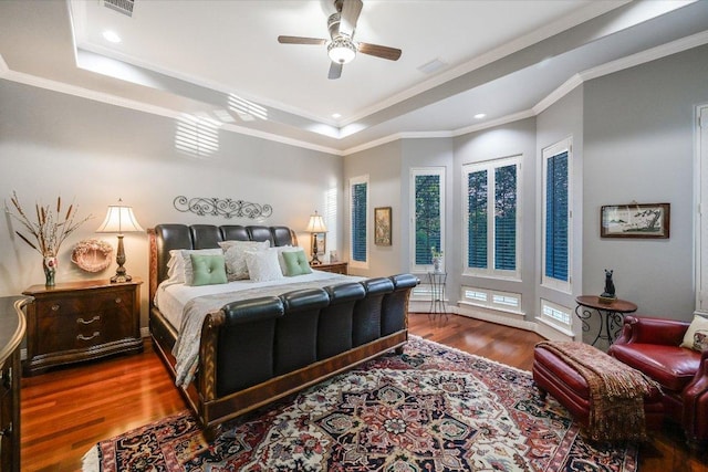 9105 Westminster Glen Ave, Austin, TX 78730 - bedroom featuring a tray ceiling, wood finished floors, recessed lighting, crown molding, and ceiling fan