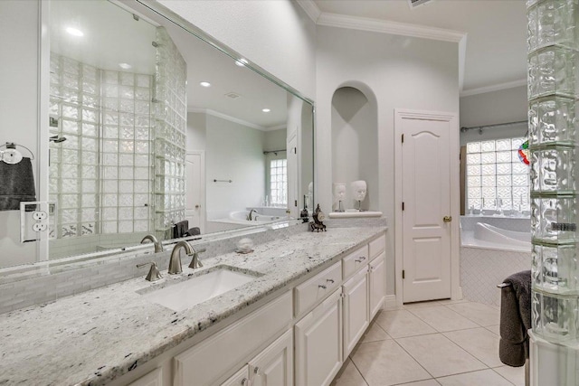 9105 Westminster Glen Ave, Austin, TX 78730 - bathroom with ornamental molding, a bath, tile patterned floors, and double vanity