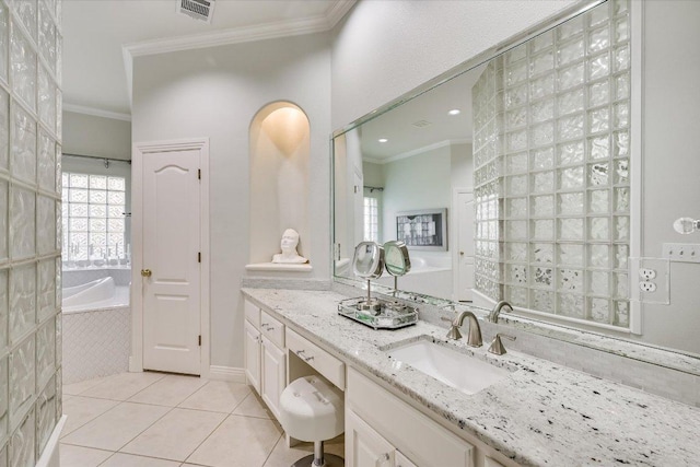 9105 Westminster Glen Ave, Austin, TX 78730 - bathroom with crown molding, tile patterned floors, a garden tub, and vanity