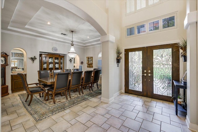 9105 Westminster Glen Ave, Austin, TX 78730 - foyer with arched walkways, french doors, ornamental molding, a towering ceiling, and recessed lighting