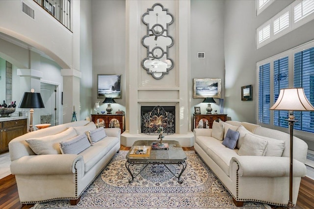 9105 Westminster Glen Ave, Austin, TX 78730 - living room with a high ceiling, wood finished floors, and arched walkways