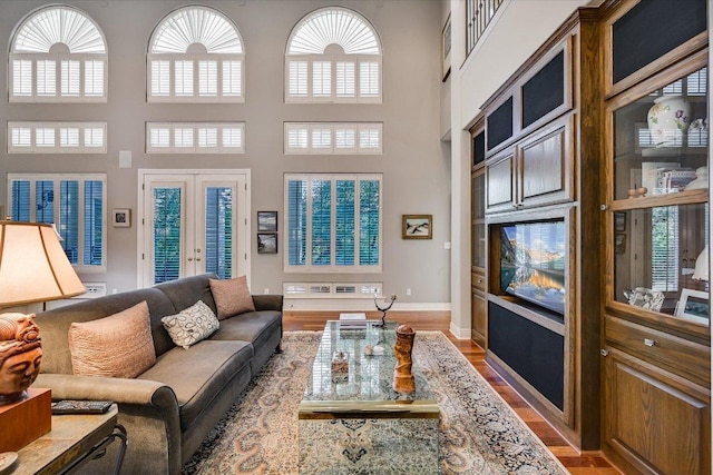 9105 Westminster Glen Ave, Austin, TX 78730 - living area featuring a high ceiling, wood finished floors, and french doors