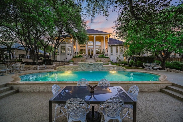 9105 Westminster Glen Ave, Austin, TX 78730 - pool at dusk with a patio area and an outdoor pool