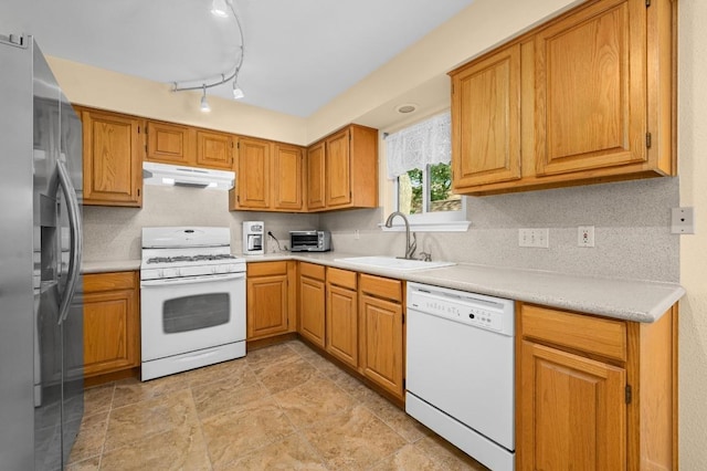 6712 Shiner St, Austin, TX 78729 - kitchen featuring white appliances, under cabinet range hood, light countertops, and decorative backsplash