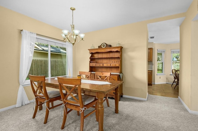 6712 Shiner St, Austin, TX 78729 - dining room with a chandelier and light colored carpet