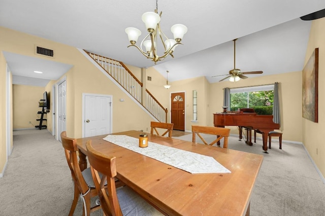 6712 Shiner St, Austin, TX 78729 - dining room featuring light carpet, stairway, ceiling fan, a chandelier, and vaulted ceiling