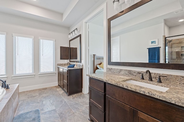 164 Mary Cornelia Cv, Buda, TX 78610 - bathroom featuring a shower stall, two vanities, and a bath