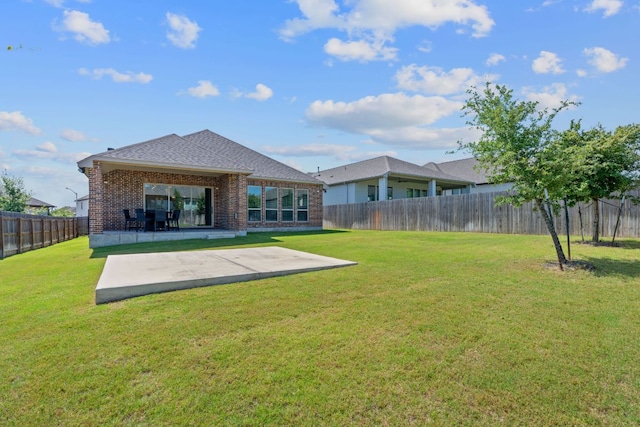 164 Mary Cornelia Cv, Buda, TX 78610 - rear view of property featuring brick siding, a patio area, a fenced backyard, and roof with shingles