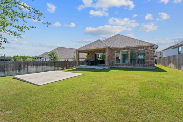 164 Mary Cornelia Cv, Buda, TX 78610 - back of house featuring a patio, brick siding, a fenced backyard, and a shingled roof