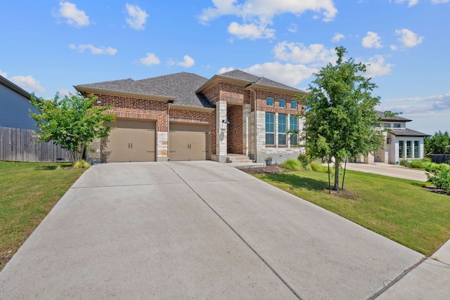 164 Mary Cornelia Cv, Buda, TX 78610 - view of front of house featuring a garage, driveway, brick siding, and a shingled roof