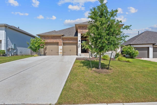 164 Mary Cornelia Cv, Buda, TX 78610 - view of front of house with brick siding, an attached garage, a front yard, driveway, and roof with shingles