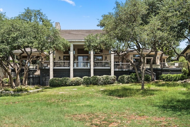 59 Stillmeadow Dr, The Hills, TX 78738 - back of property with a wooden deck and a lawn
