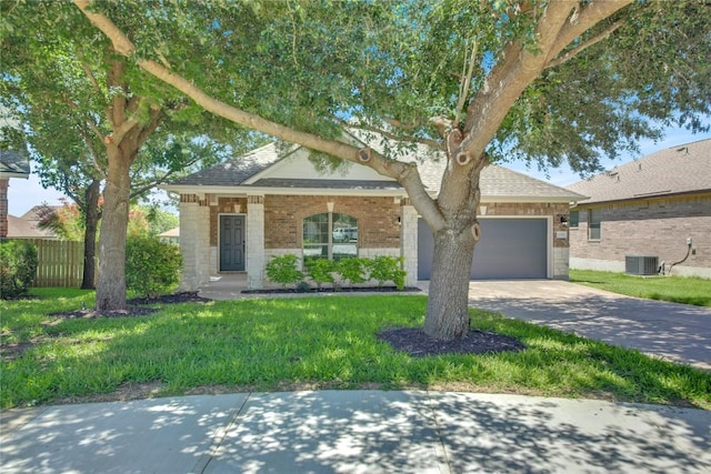 1086 Sussex Way, Round Rock, TX 78665 - view of front facade featuring an attached garage, concrete driveway, brick siding, and roof with shingles