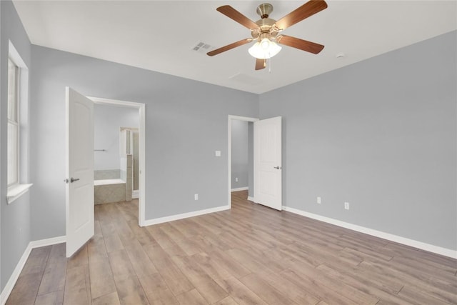1086 Sussex Way, Round Rock, TX 78665 - unfurnished bedroom featuring light wood-style floors and a ceiling fan
