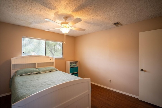 8403 Ardash Ln, Austin, TX 78759 - bedroom with dark wood-style floors, a textured ceiling, and a ceiling fan