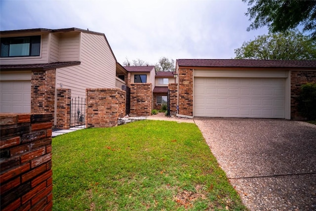 8403 Ardash Ln, Austin, TX 78759 - view of front facade with driveway, brick siding, and a front yard