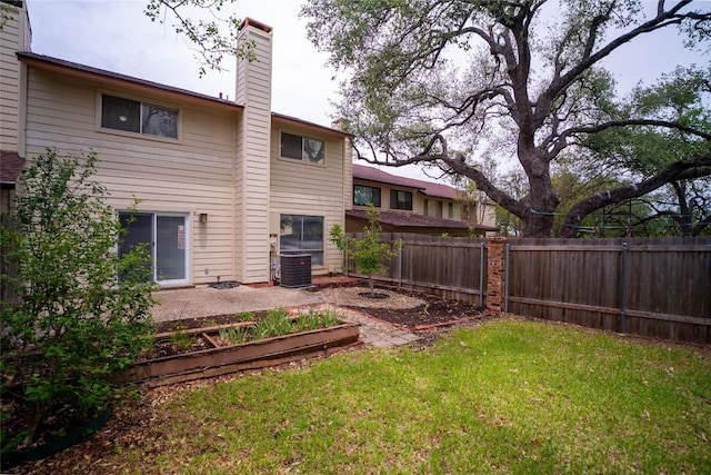 8403 Ardash Ln, Austin, TX 78759 - rear view of property featuring a chimney and a fenced backyard