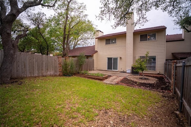 8403 Ardash Ln, Austin, TX 78759 - back of property featuring a fenced backyard, a chimney, and a vegetable garden