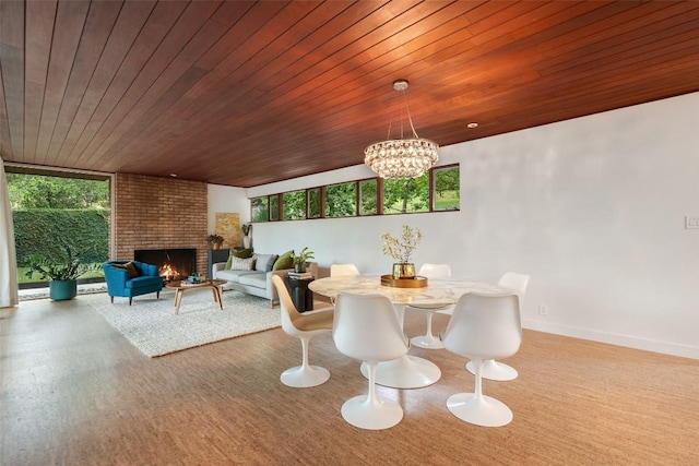 4506 Crestway Dr, Austin, TX 78731 - dining area featuring wood ceiling, a chandelier, a brick fireplace, and wood finished floors