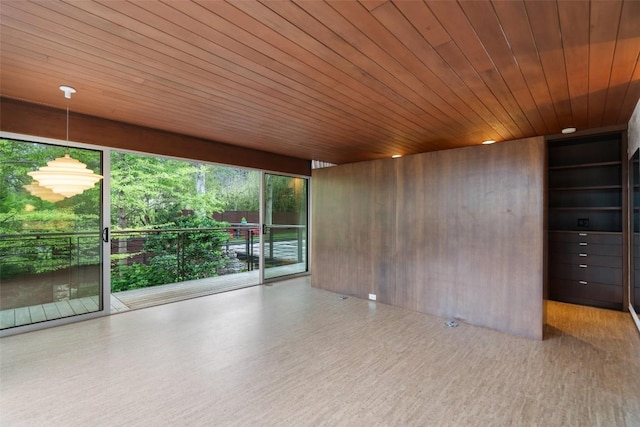 4506 Crestway Dr, Austin, TX 78731 - spare room featuring wood finished floors, wooden ceiling, and wood walls