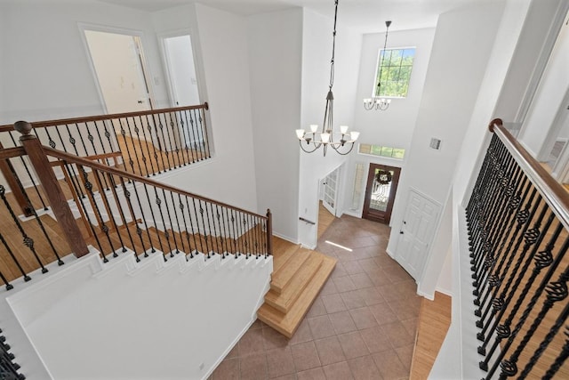 20936 Prestwick Dr, Hutto, TX 78634 - tiled entrance foyer featuring a chandelier and stairway