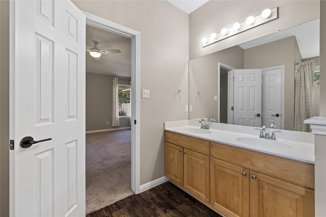 3203 Saint Genevieve Dr, Leander, TX 78641 - full bathroom featuring double vanity, wood finished floors, and a ceiling fan