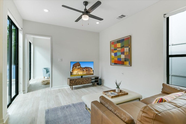 902 W Live Oak St, Austin, TX 78704 - living room featuring light wood-type flooring, ceiling fan, and recessed lighting