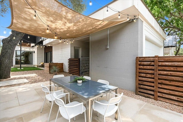 902 W Live Oak St, Austin, TX 78704 - view of patio featuring outdoor dining area and a garage