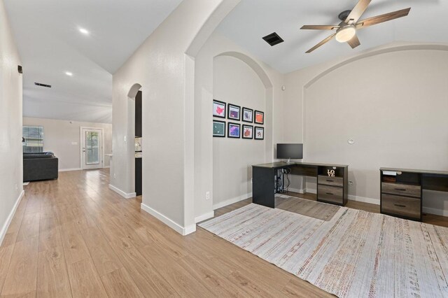 101 Desert Highlands Trl, Round Rock, TX 78665 - home office with a ceiling fan, wood finished floors, arched walkways, and high vaulted ceiling