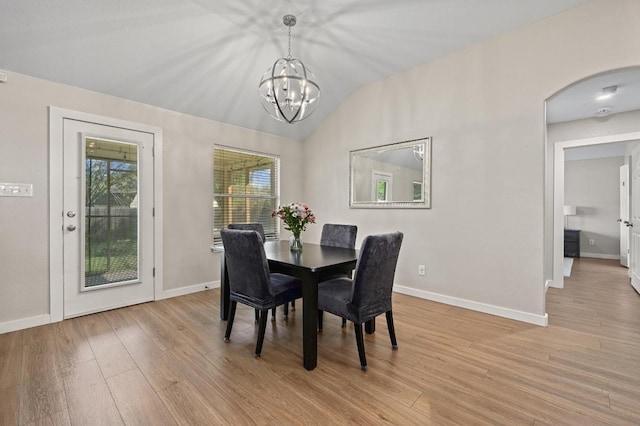 101 Desert Highlands Trl, Round Rock, TX 78665 - dining area with a chandelier, lofted ceiling, arched walkways, and light wood-style flooring