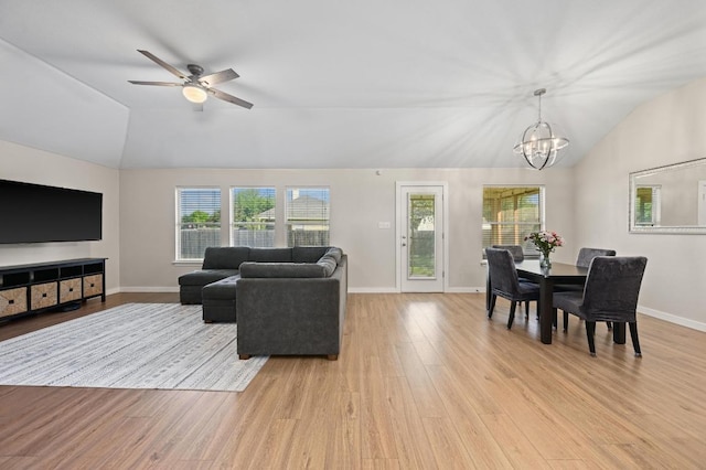 101 Desert Highlands Trl, Round Rock, TX 78665 - living area featuring vaulted ceiling, light wood finished floors, a chandelier, plenty of natural light, and ceiling fan