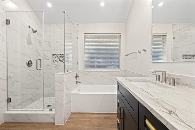101 Desert Highlands Trl, Round Rock, TX 78665 - full bathroom with a bath, wood finished floors, vanity, a marble finish shower, and recessed lighting