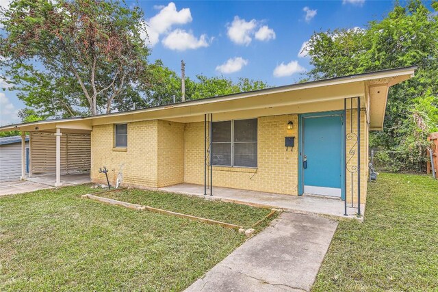 4805 Hilldale Dr, Austin, TX 78723 - view of front of home featuring a front yard and brick siding