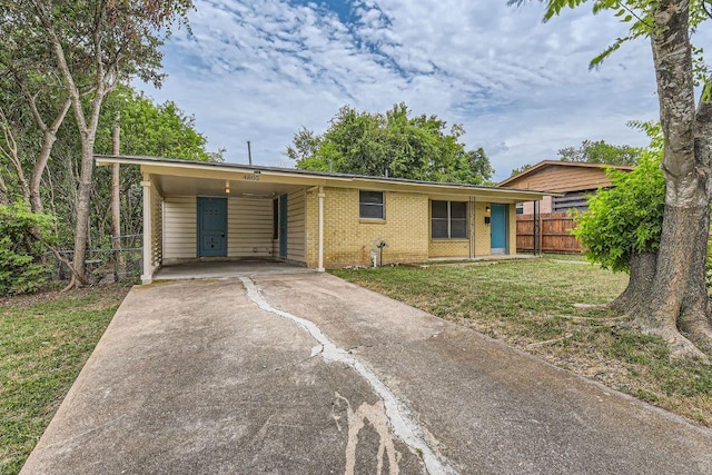 4805 Hilldale Dr, Austin, TX 78723 - single story home with brick siding, driveway, and a carport
