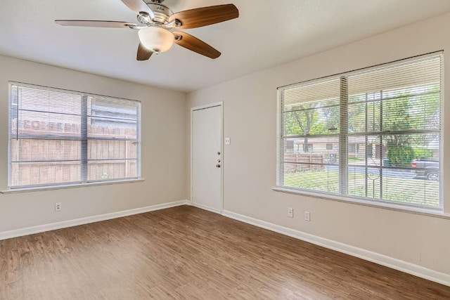 4805 Hilldale Dr, Austin, TX 78723 - unfurnished room featuring wood finished floors and a ceiling fan