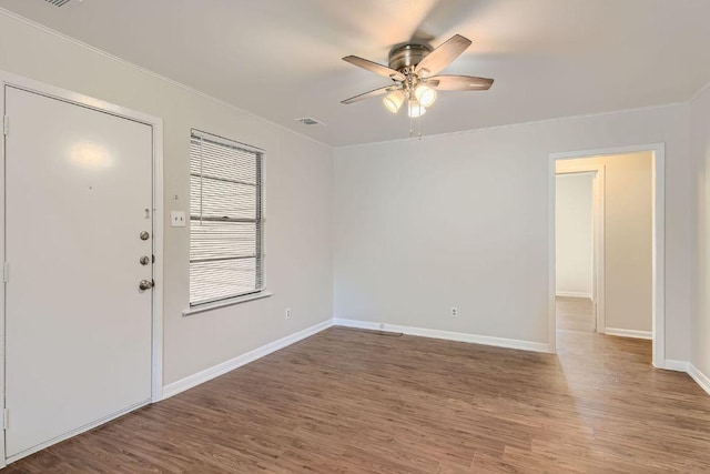 4805 Hilldale Dr, Austin, TX 78723 - entrance foyer featuring ornamental molding, ceiling fan, and wood finished floors