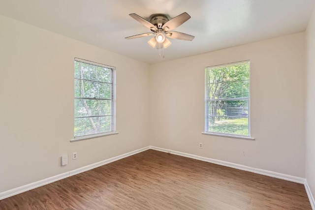 4805 Hilldale Dr, Austin, TX 78723 - unfurnished room with plenty of natural light, wood finished floors, and ceiling fan