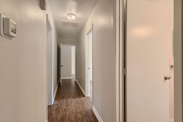4805 Hilldale Dr, Austin, TX 78723 - corridor featuring baseboards and dark wood-style floors