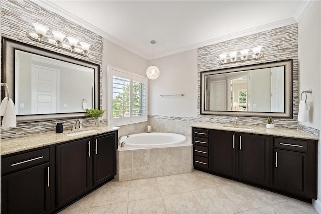 108 Kildrummy Ln, Lakeway, TX 78738 - full bath featuring a garden tub, two vanities, tile patterned floors, crown molding, and backsplash