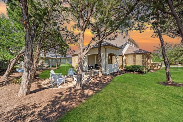 108 Kildrummy Ln, Lakeway, TX 78738 - view of front of property featuring an outdoor fire pit and stucco siding