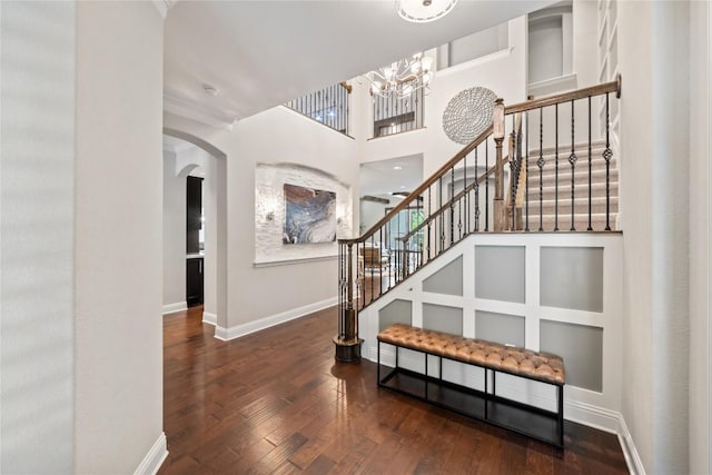 108 Kildrummy Ln, Lakeway, TX 78738 - entrance foyer with a chandelier, stairway, and wood-type flooring