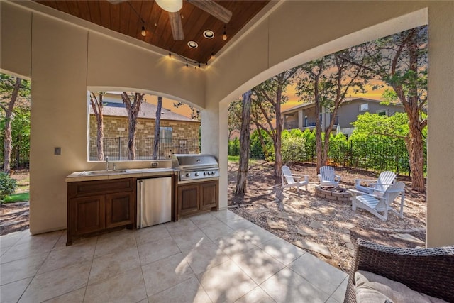 108 Kildrummy Ln, Lakeway, TX 78738 - view of patio / terrace featuring exterior kitchen, a ceiling fan, and a fire pit